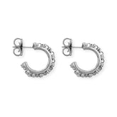 A closeup of silver hoop earrings designed and hand-crafted by DelBrenna Italian Jewelers in Tuscany. The earrings are designed based on the iconic Links collection of DelBrenna silver chains, necklaces, rings, and bracelets.
